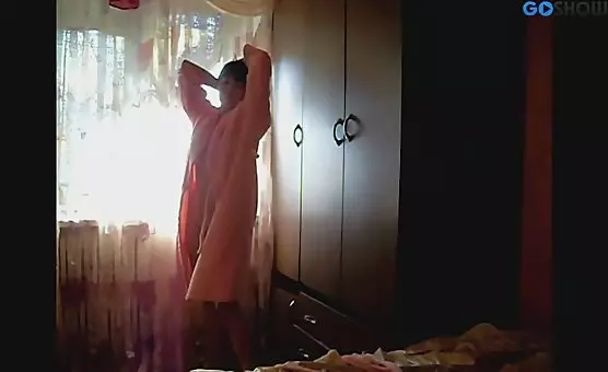 Charming Brunette Teases with Tits and Ass in Bathrobe